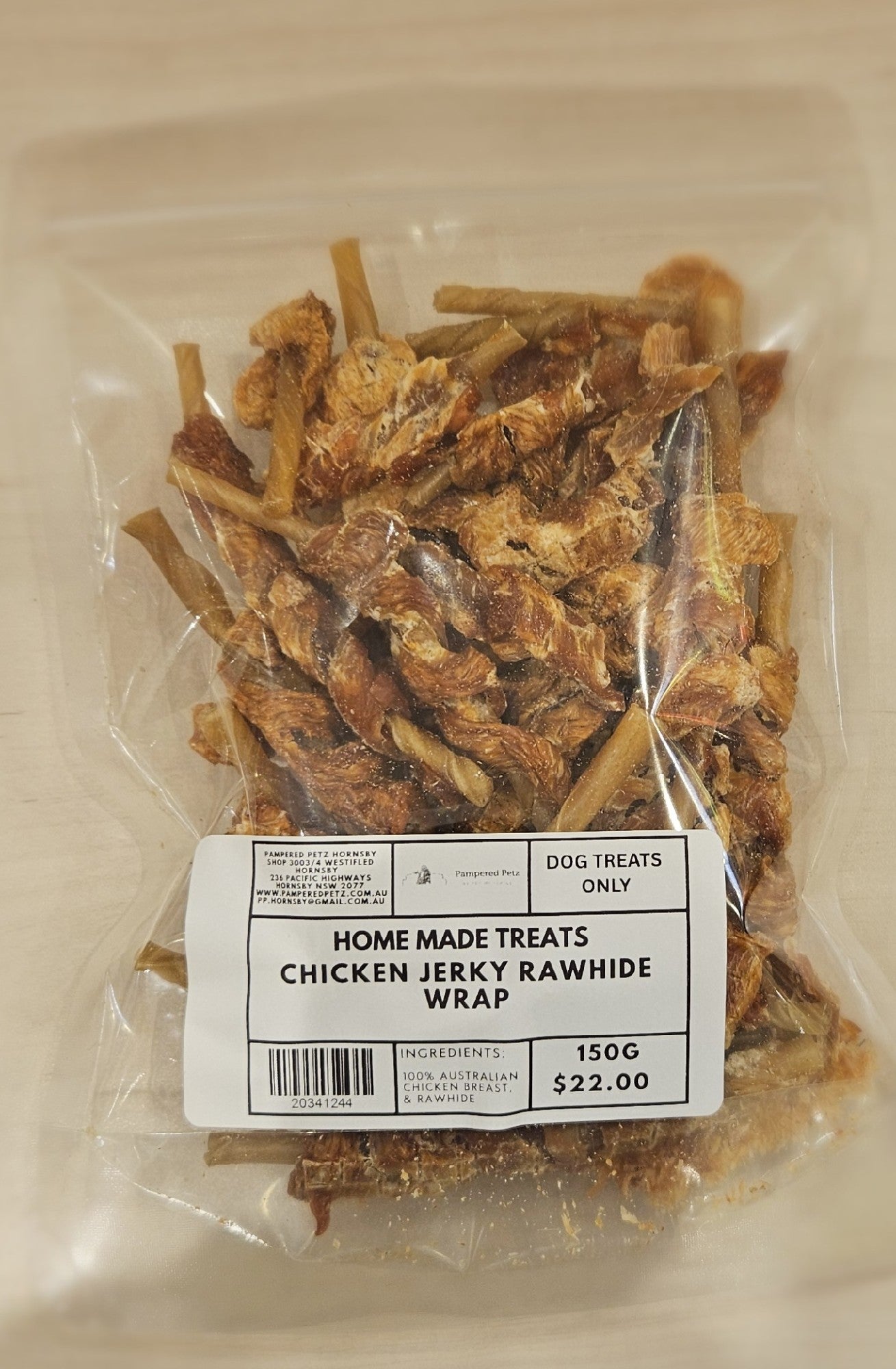PAMPERED PETZ HORNSBY HOME MADE TREATS CHICKEN JERKY RAWHIDE WRAP 150G